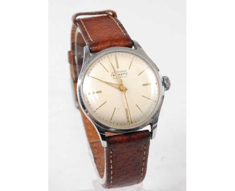 A gent's Junghans Trilastic steel cased vintage wristwatch, having a signed champagne dial with baton markers, luminous hands