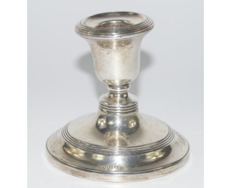 A George VI silver dwarf candlestick, with reeded borders, Birmingham 1945, 8cm high, (AF).