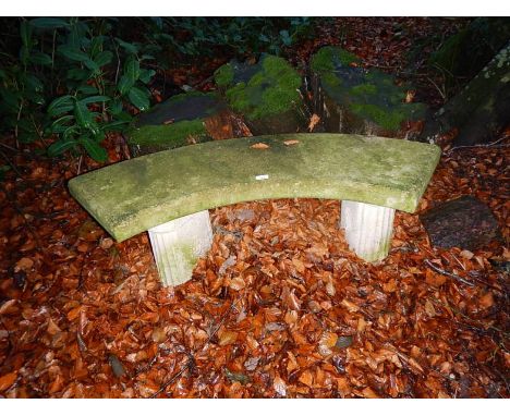 A reconstituted stone garden bench.