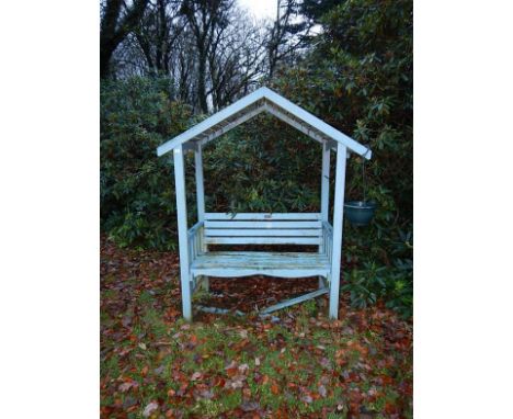 A garden bench seat with canopy roof.