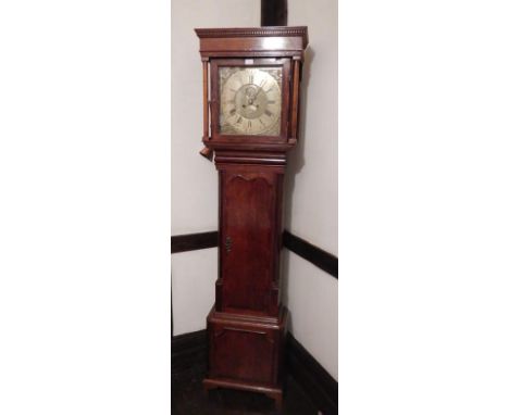 A George III oak longcase clock, with dentil cornice and later pillared decoration, the full length shaped trunk door crossba