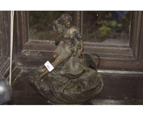 A modern Spelter finish centrepiece, formed as a lady before open shelf.