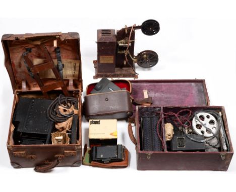 A Kodak table-top film projector, c. 1930,&nbsp;39cm h, camera and camera equipment.&nbsp; Sold as seen. The projector with r