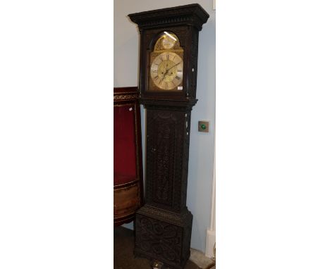 ~ A carved oak eight day longcase clock, arch brass dial signed Peter Hogg, Felton, 18th century and later, later case 