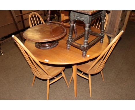 Ercol light elm drop leaf table, together with four matching chairs 