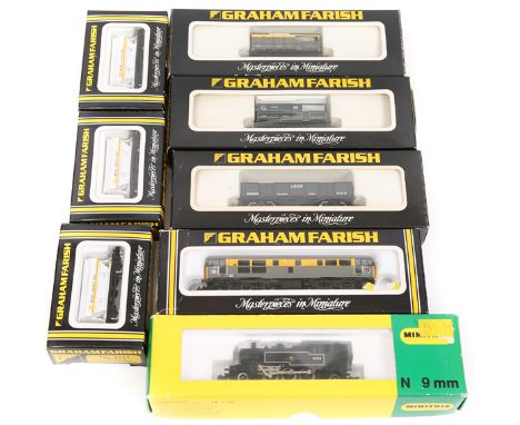 A quantity of ‘N’ gauge Locomotives and freight wagons. A Minitrix BR LMR 2MT 2-6-2 tank locomotive RN 41234 in black livery.