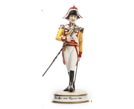 A small scale “Michael Sutty Porcelain Manufactory” figure of a “Drum Major 34th Regiment, 1811”, in full dress “carrying cap