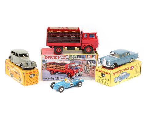 7 Dinky Toys. A Bedford Coca-Cola Truck (402) in red and white livery, with blue cab interior and bottle load. A Ford Anglia 