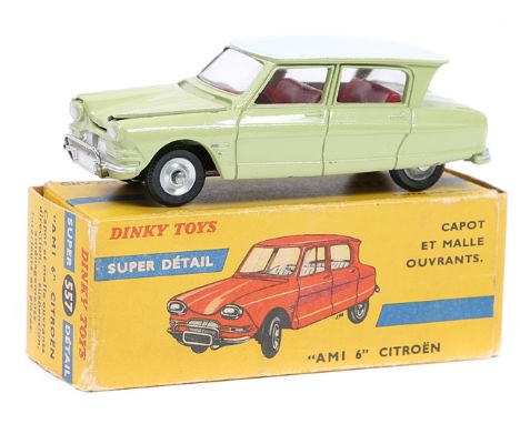 A French Dinky Toys AMI 6 Citroen (557). In light green with pale grey roof and red interior. Boxed, minor wear. Vehicle Mint