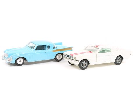 2 Corgi Toys. Ford Mustang (325). In white with red racing stripes and pale blue interior with spoked wheels. Plus a Studebak