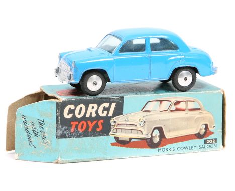 Corgi Toys Morris Cowley Saloon (202). An example in mid blue with flat spun wheels. Boxed, worn/damaged. Vehicle GC-VGC ligh