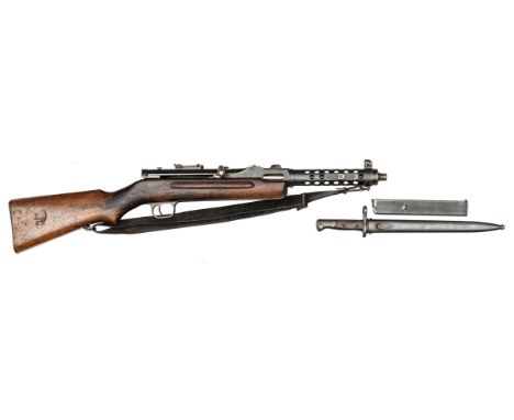 An “old spec” de-activated German MP34 machine pistol, number 4307 on action and butt, with clear Waffenamt marks at the bree