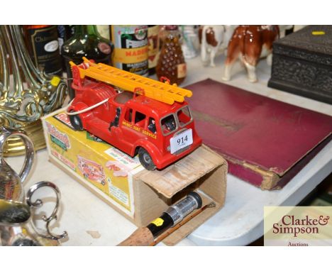 A Tri-ang series 2 scale model fire fighter with original box