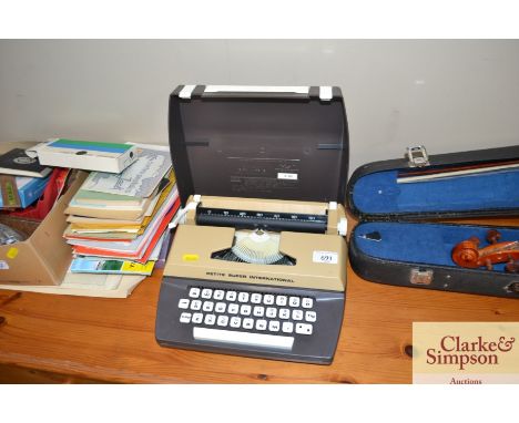 A petite Super International portable typewriter
