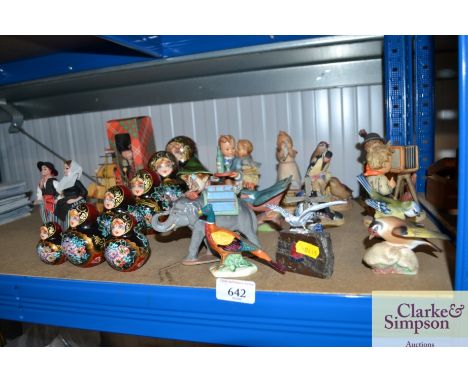 A quantity of decorative china to include Goebel figures; Russian dolls; souvenir dolls etc