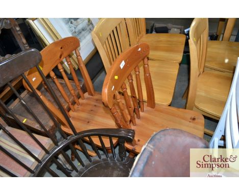 A pair of pine stick back dining chairs