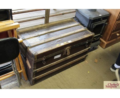 A wooden and metal storage trunk 