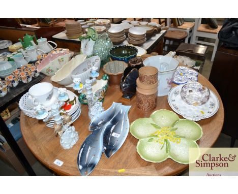 A large quantity of various china to include Sylvac style vases; jelly mould; pedestal bowl; gurgling fish; a pair of candle 