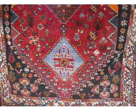 Small middle eastern red ground carpet 70cm x 42cm