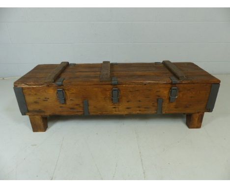 Metal bound table in the form of a trunk