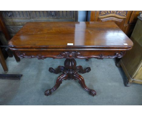 A Victorian mahogany fold over card table 