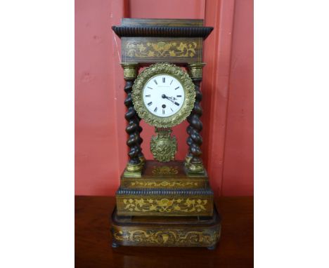 A 19th Century French inlaid rosewood portico clock, with turned barleytwist columns, the enamel dial signed Thomas a Paris 