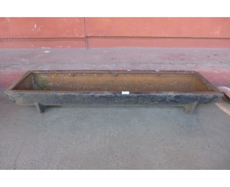 A cast iron feeding trough 