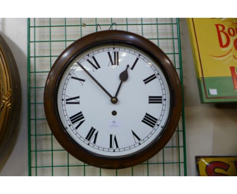 A mahogany circular wall clock 