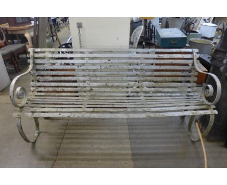 A Victorian wrought iron garden bench 