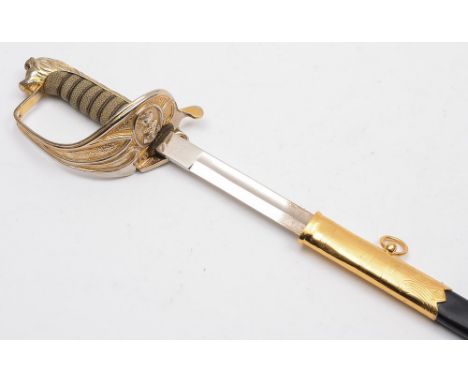 A modern Naval officers dress sword: with 78cm fullered blade with fouled anchor cypher, gilt brass knuckle guard with foldin