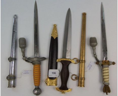 Three German Army and Navy style daggers with scabbards: (3).

