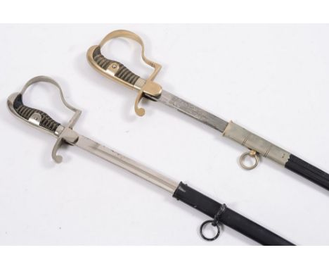An Imperial German Army Sabel, by WKC and a similar Feuerwehern sabel:, both with wire bound grips in scabbards (2)