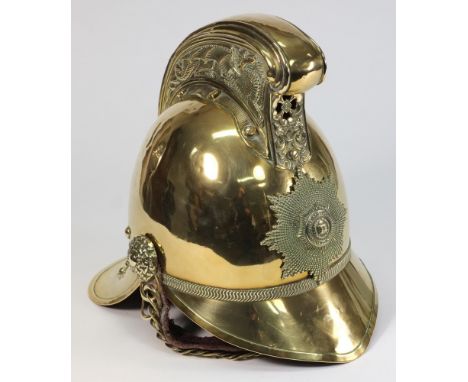 An Edwardian brass Merryweather pattern  Fireman's helmet:, the front plate with National Fire Brigade Association detail , e