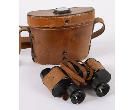 A pair of U.S. Army Signal Corps issue field glasses: by Bausch & Lomb, serial No EE. 290484, contained in a leather case wit