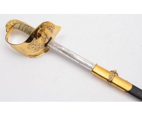 An R.A.F. Officer's dress sword: with 83cm. fullered and etched blade with RAF cypher, gilt brass knuckleguard with pierced f