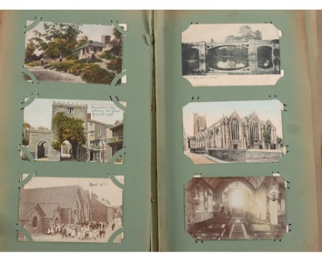 An early 20th century postcards album of Devonshire and GB topographical views:, to include Cullompton, Lifton. London and ot