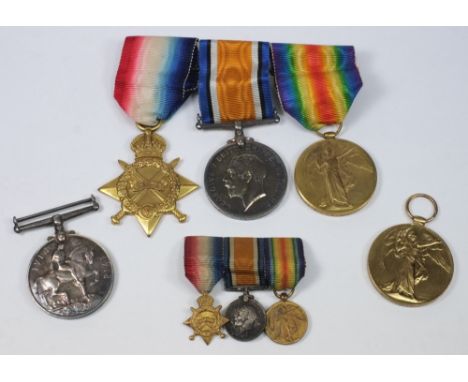 A family group of two sets of WWI service medals:, comprising a trio and matching miniatures named 'Payr Lt  C L Pinching RNR