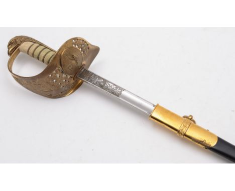 An R.A.F. Officer's dress sword: with 83cm. fullered and etched blade with RAF cypher, gilt brass knuckleguard with pierced f