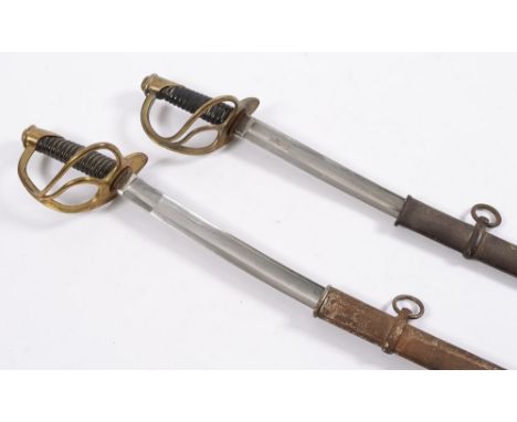 Two unmarked European cavalry swords:, both with curved fullered blades, oval brass hilt and three bar guard , wire bound bla