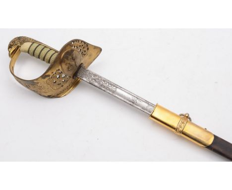 An R.A.F. Officer's dress sword: with 83cm. fullered and etched blade with RAF cypher, gilt brass knuckleguard with pierced f