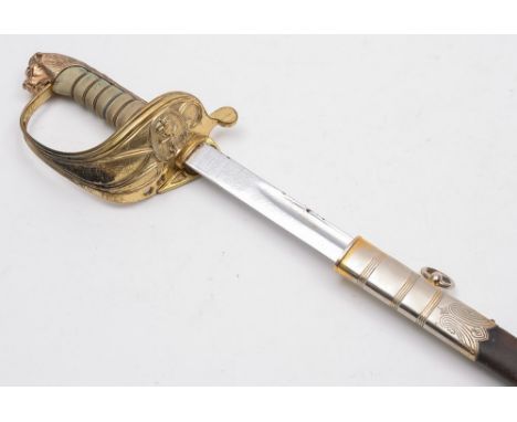 A modern Naval officers dress sword: with 78cm fullered blade with fouled anchor cypher, gilt brass knuckle guard with foldin