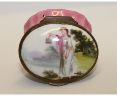18th century English enamel snuff box, a classical female figure to the hinged mirrored cover above pink base, 4cm wide.