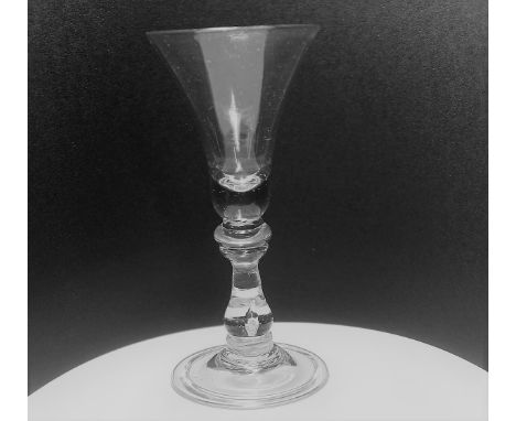 18th century baluster wine glass, the stem with double cushion knop above an upright baluster centre with a tear on a basal k