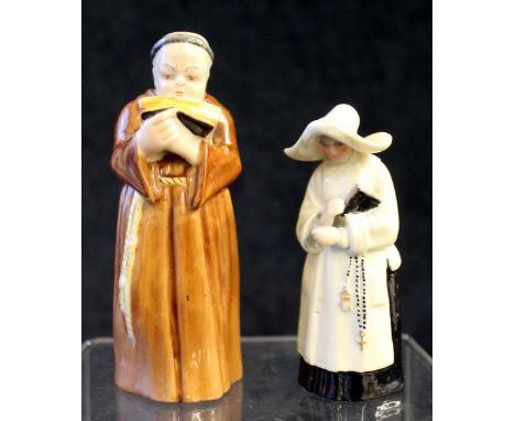 Royal Worcester candle snuffer in the form of a standing monk & another of a standing nun, 9cm high.  (2).