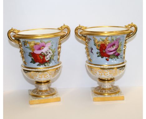 Fine pair of Barr Flight & Barr Campana shaped vases, each with gilt entwined serpent handles & gilt rim against pale blue pa