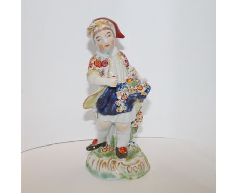 Derby figure of a child flower seller, polychrome decorated with floral encrustations & naturalistic hollow domed base with p