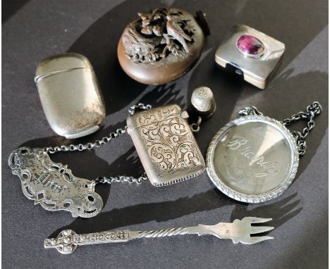 Two silver vesta cases, Birmingham 1884, a decanter label "Port", Birmingham, 1866, another and four other items (8).