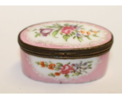 18th century English enamel oval patch or snuff box, floral reserves against pink ground, 6cm wide.
