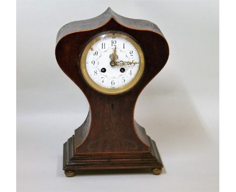 French Art Nouveau mantel clock, the white enamel dial with floral swags in mahogany case with inlaid brass entrelac.