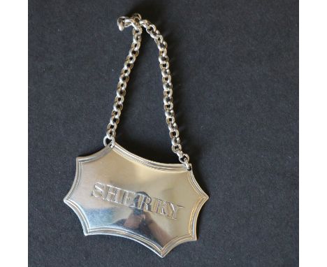 Silver decanter label of cusped rectangular shape with thread edges, engraved for 'Sherry', by Abstain & King, c.1800. Condit